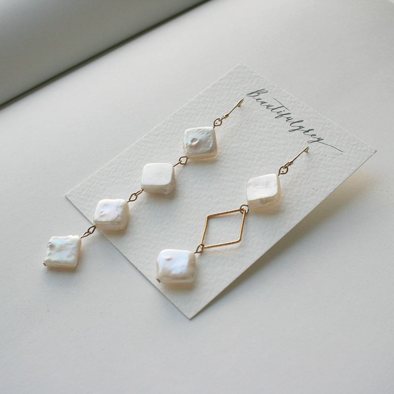pearls in diamond earrings